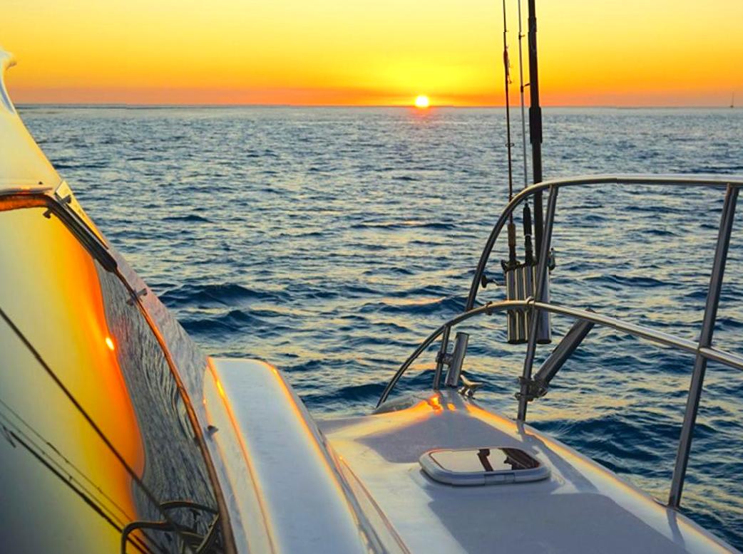 Sail Along the Reef at Sunset: Enjoy a sunset sail along the reef.