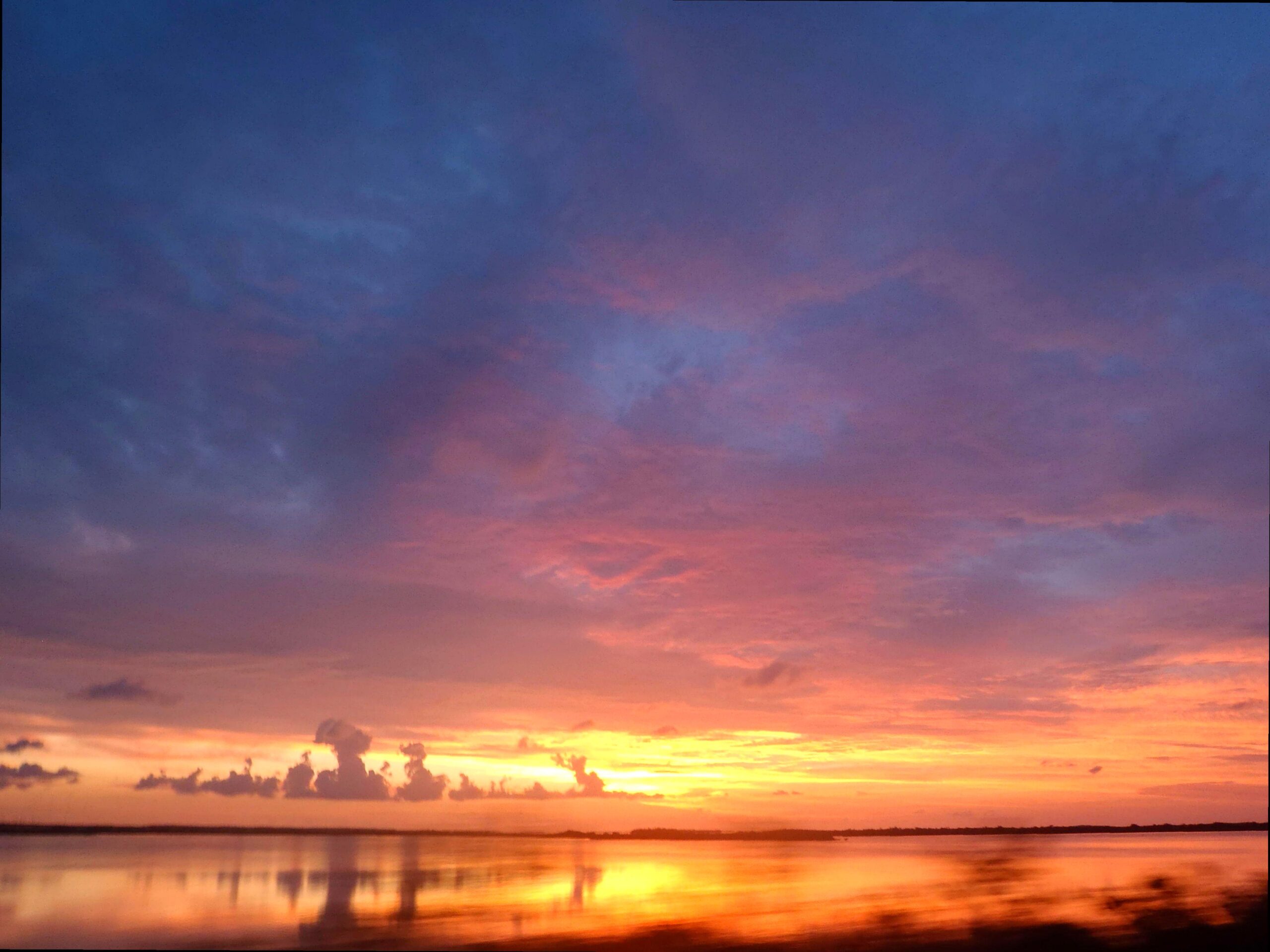 Sail at Dusk Along Vibrant Reef Waters